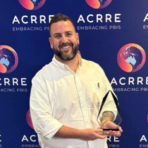 Jeramy Nusco with award from ACRRE