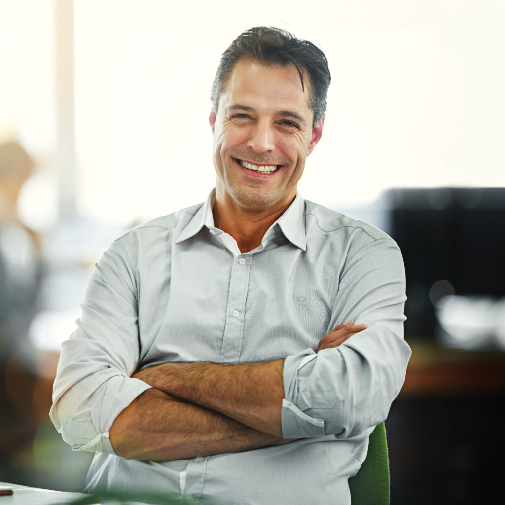 Mature, business and portrait of happy man with arms crossed, smile or confidence in startup company. Boss, male director or proud manager ready for project development for growth in office workplace.